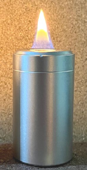 A lit AlCandle: a slim aluminum can with a small orange flame on top